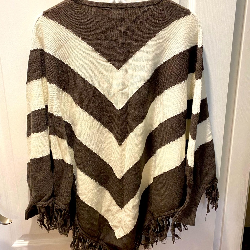 Poncho style with sleeves